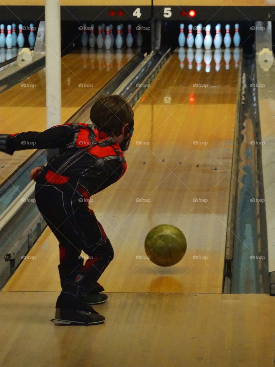 Boy Throwing A Bowling Ball