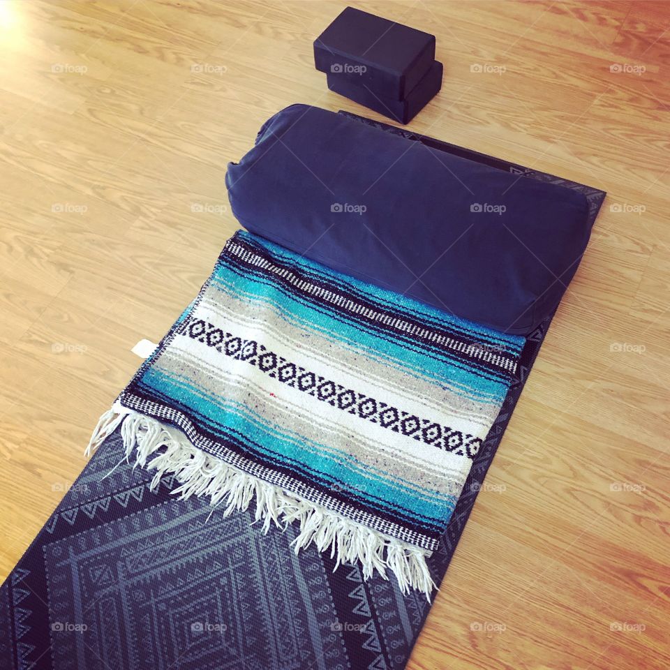 Yoga mat, blanket, bolster, and blocks