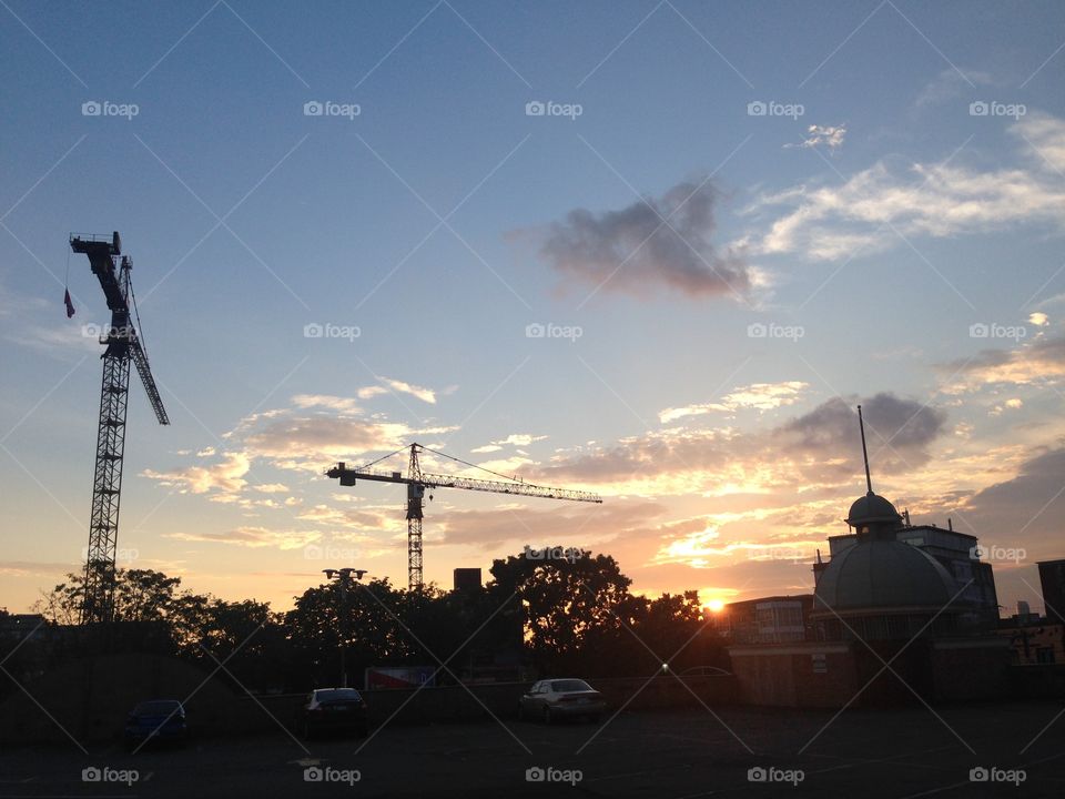 There are condos going up all over my neibourhood.  But the cranes look cool in the evening light. 