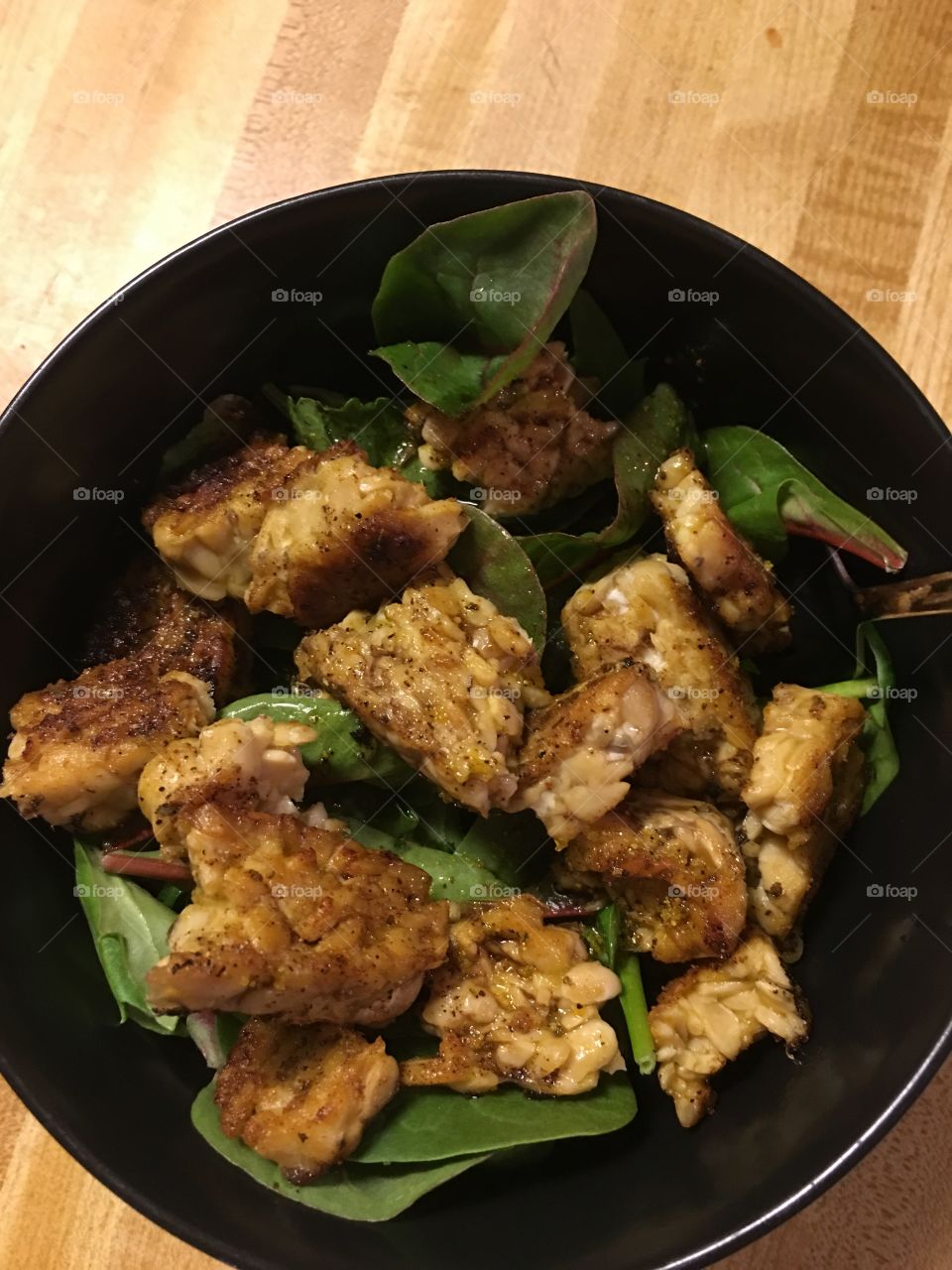 Tempeh and spinach salad with homemade lemon vinaigrette.