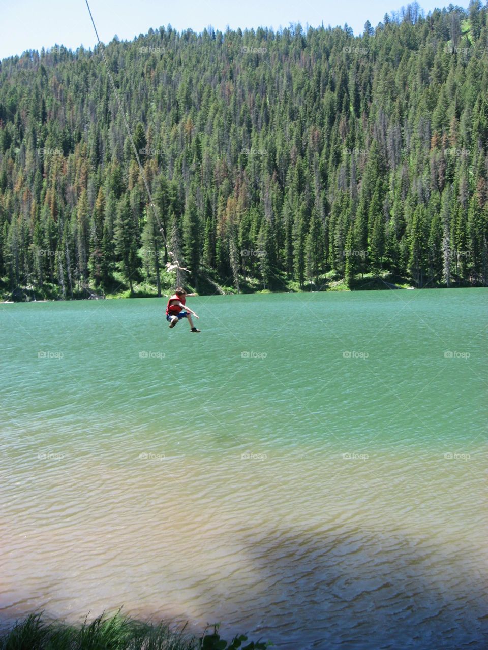There is never a time more free than falling from the rope swing into the icy water at a mountaintop lake.