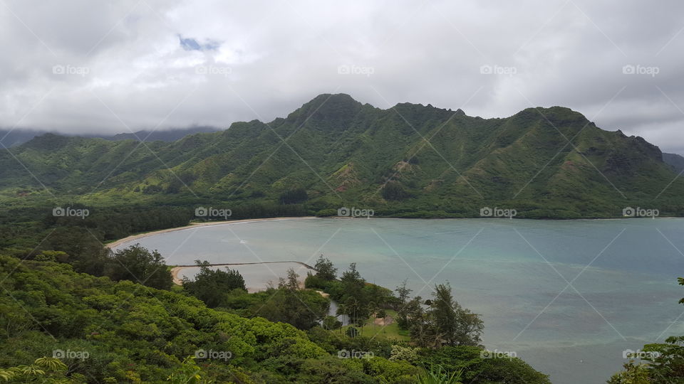 Scenic view of mountains against cloudy sky