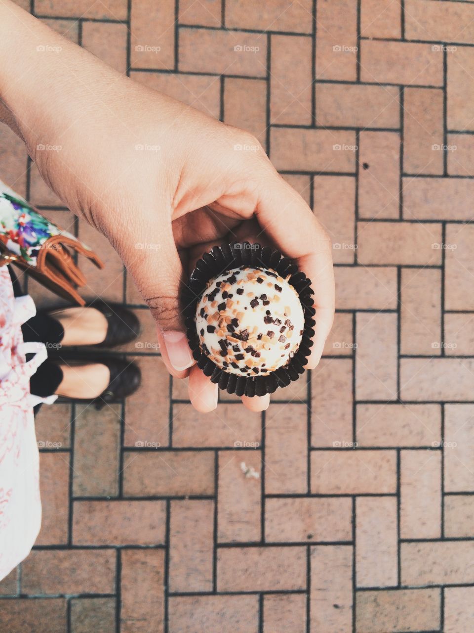 Woman holding a cup cake