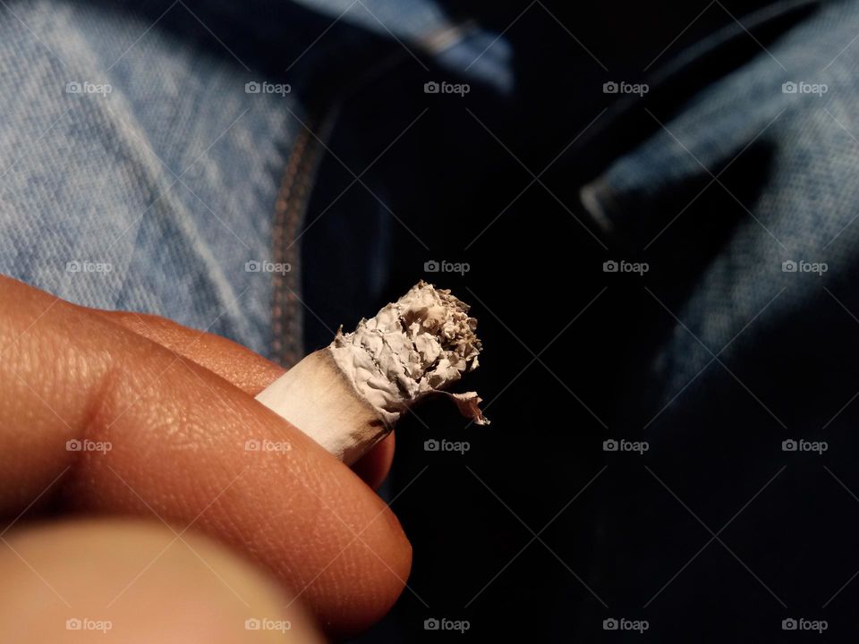 fingers with a cigarette