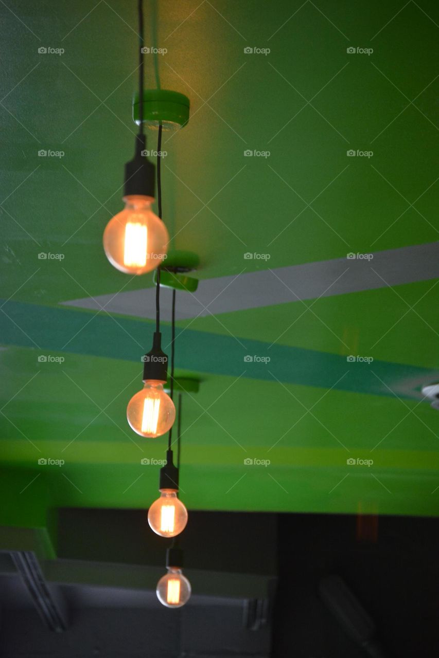 Light bulbs on green ceiling