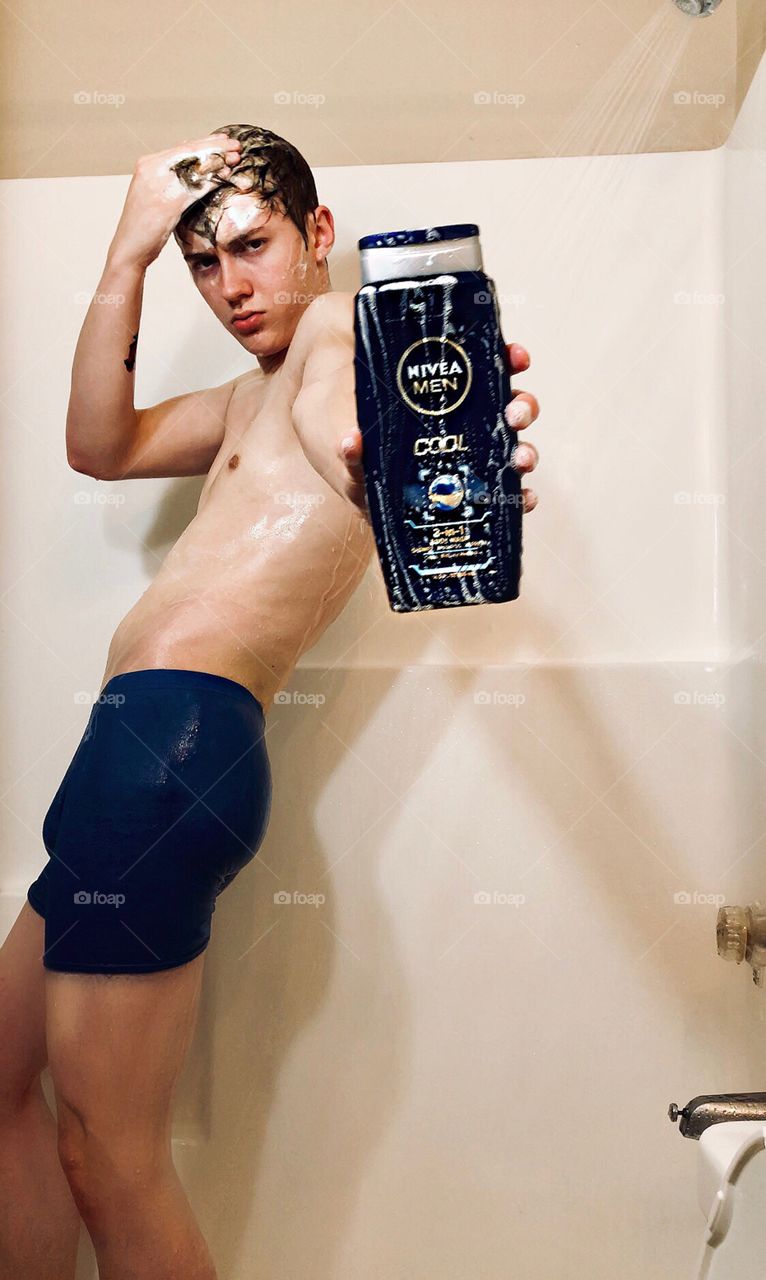 Sexy Boy showering with Nivea shampoo 