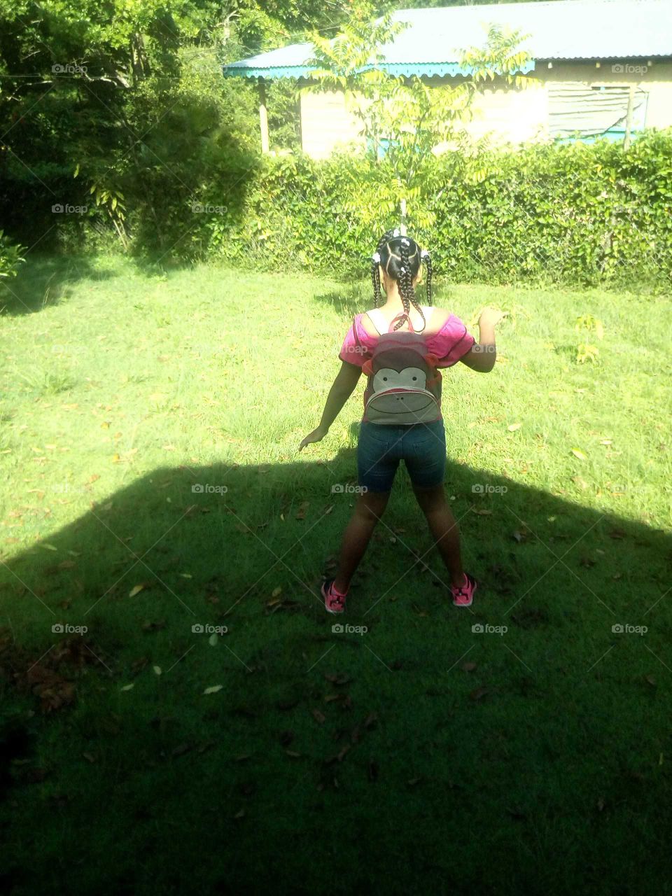 this grass is so green and and the sun light is so Brite and this beautiful girl is just enjoying her self