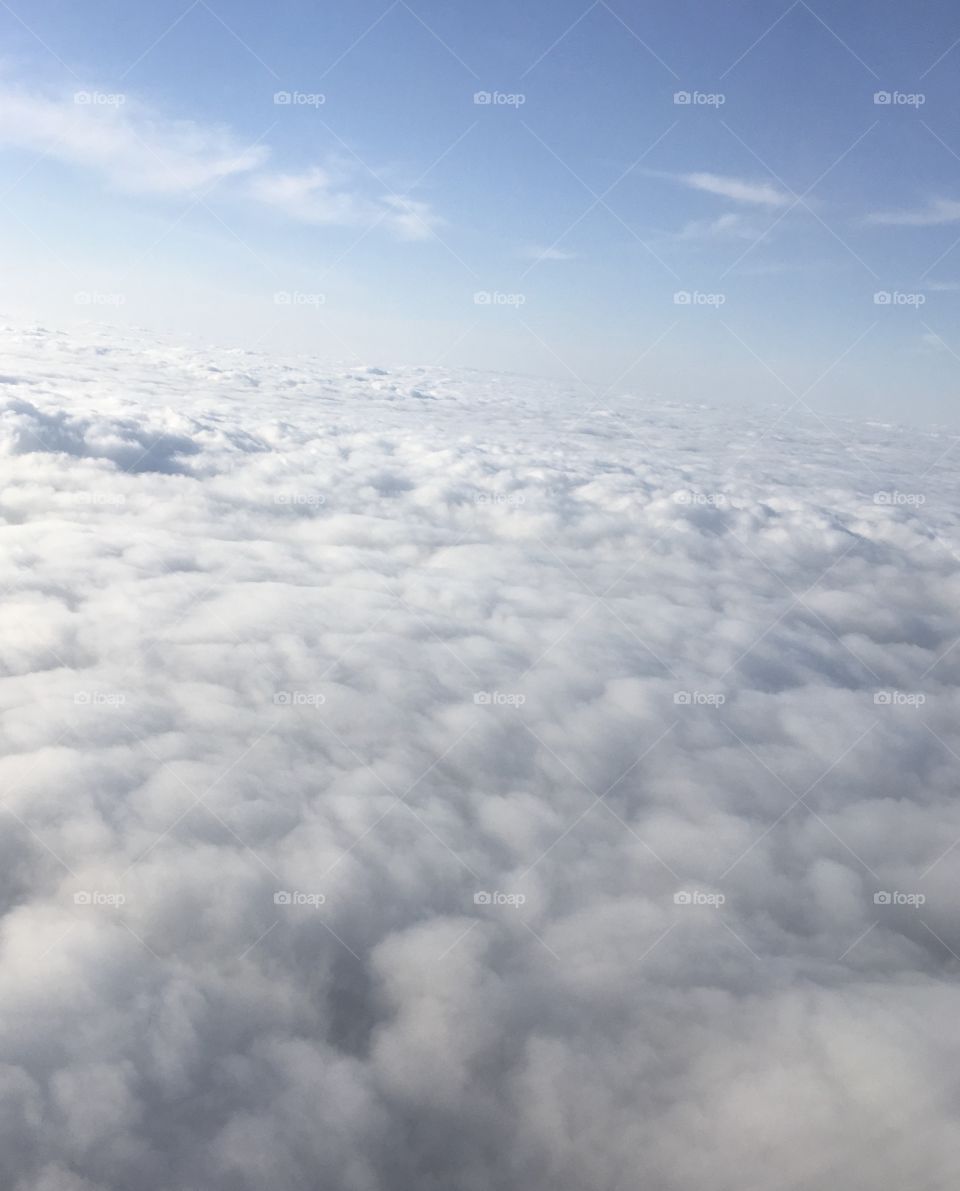 Fluffy midflight clouds 