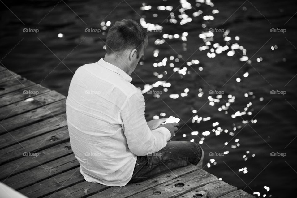 the man is using the phone