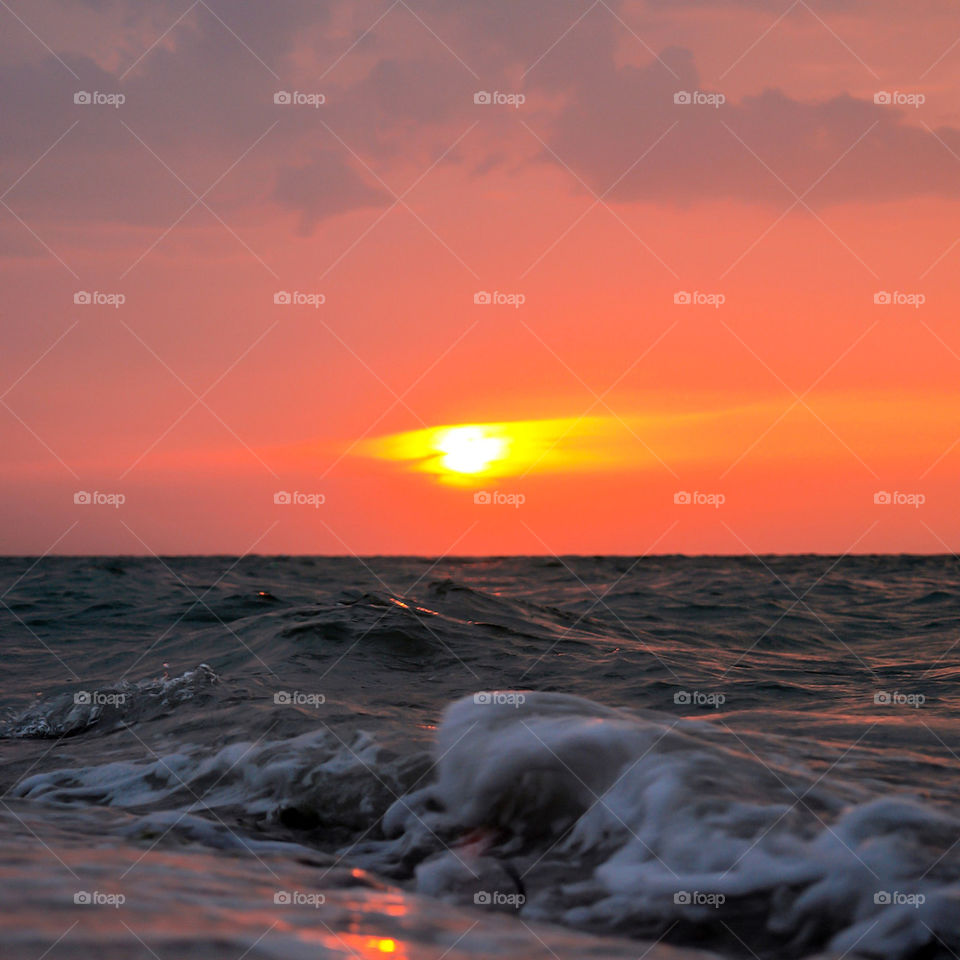 SUNSET AT A YUCATAN PENINSULA BEACH.MEXICO