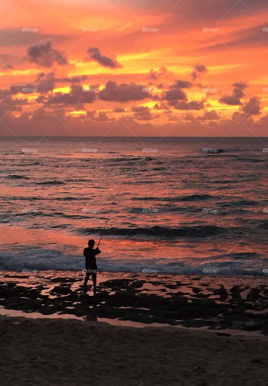 Fisherman at sunset 