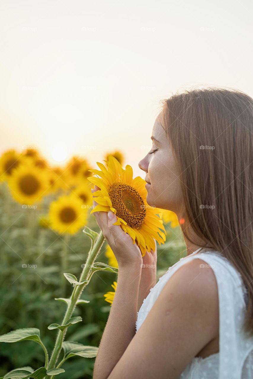 young woman in sunflowers