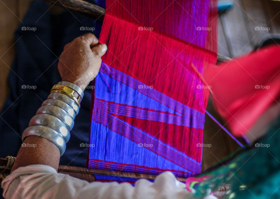 Close-up of women weaving