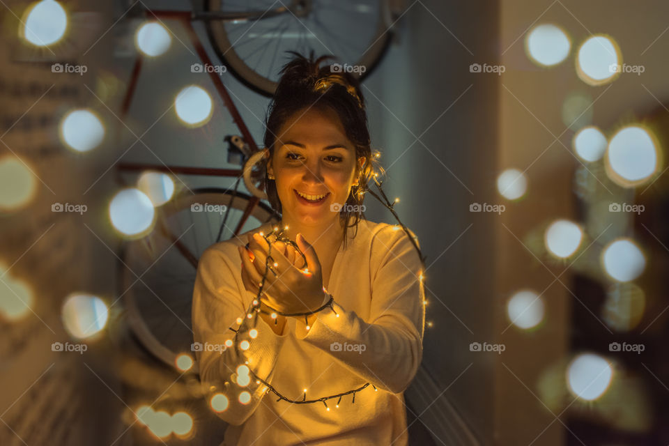 Happy girl playing with lights