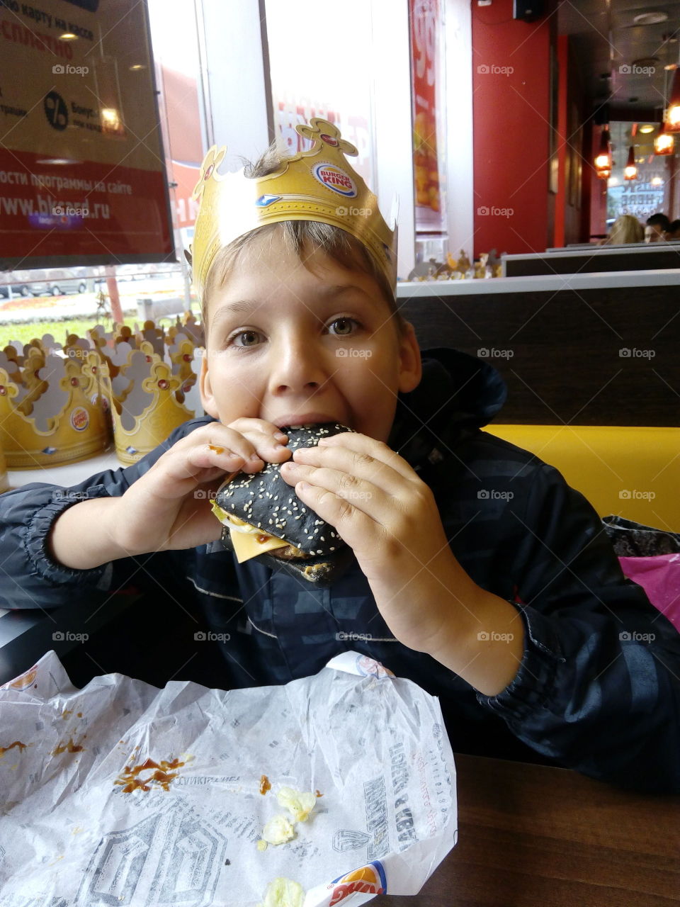 A child eats his favorite burger