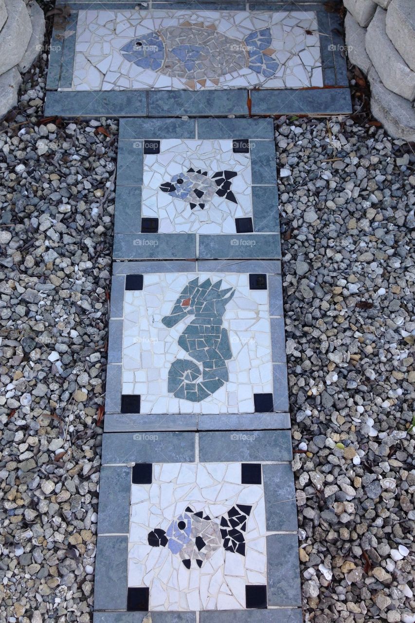 Fish and seahorse mosaic stepping stones sidewalk path