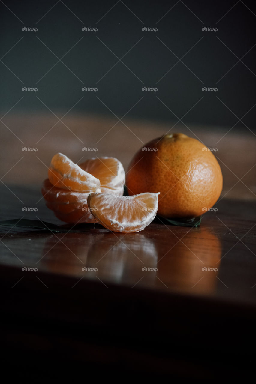 Tangerine fruit on table.
