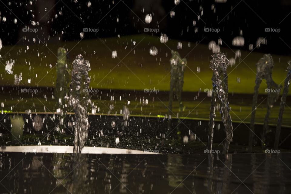 Water in motion playful silhouettes in a fountain abstract water photography background 