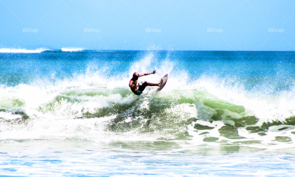 Surfing at Kute Beach Bali