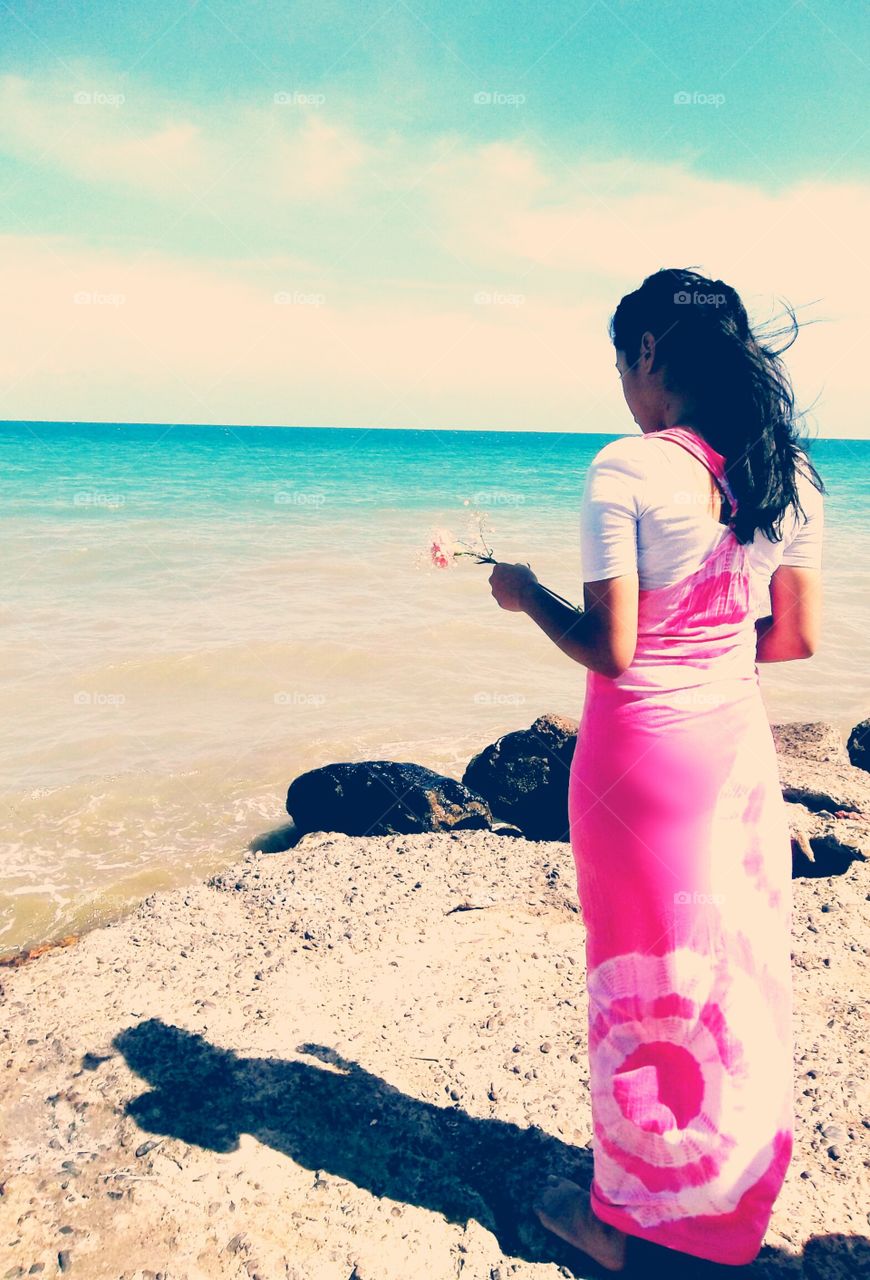 Thinking about my purpose. I took this picture at the beach near my house, the model is one of my friends. She is part of the pentecostal youth group I'm part of, in this picture she is thinking about the purposes that God has for her. 