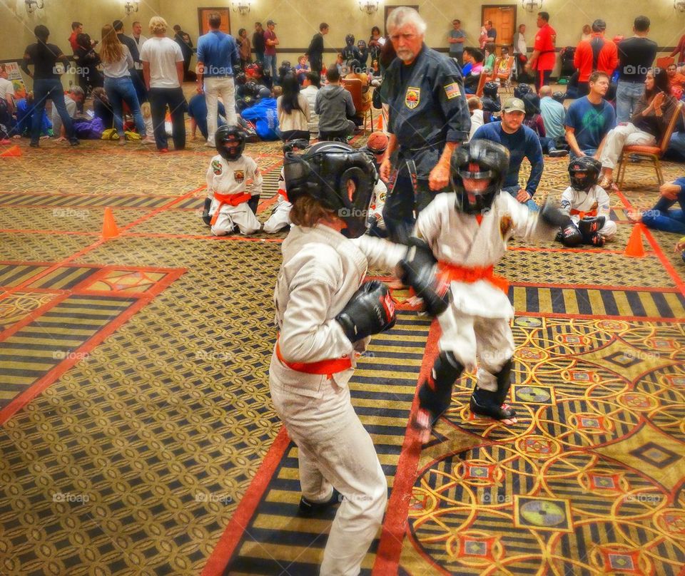 Kids in a martial arts tournament 