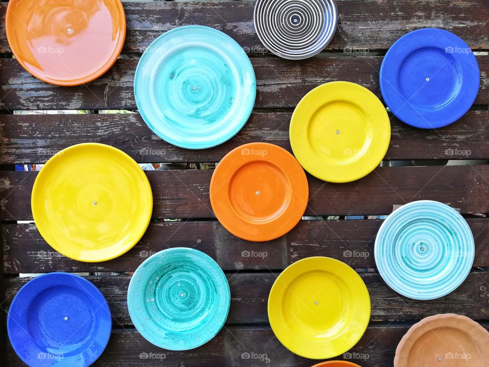 Colored ceramic plates attached to the wall