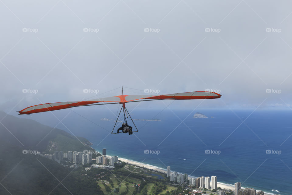 Hang gliding flying over Sao Conrrado in Rio de Janeiro Brazil.