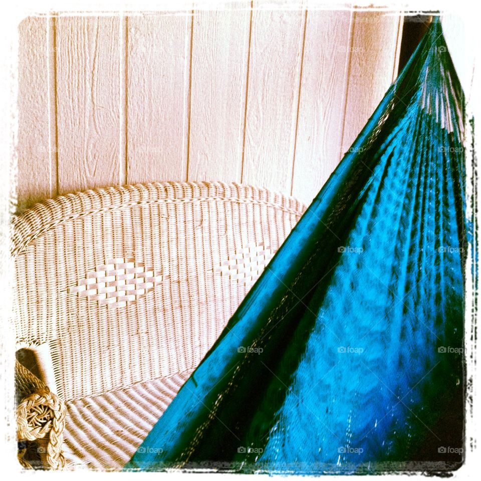 Relaxing in a blue hammock on the porch.