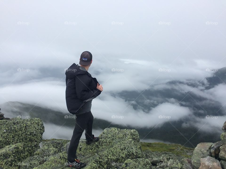 My friend  takes in the view off of Mount Madison in the white mountains of New Hampshire