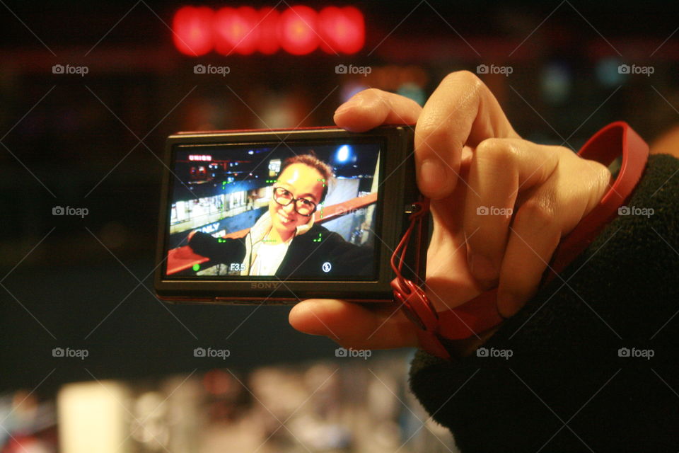 Close-up of hand holding camera
