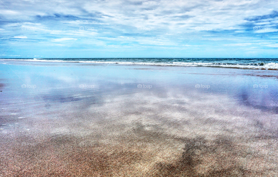 Retrieving sea flat beach sky reflection
