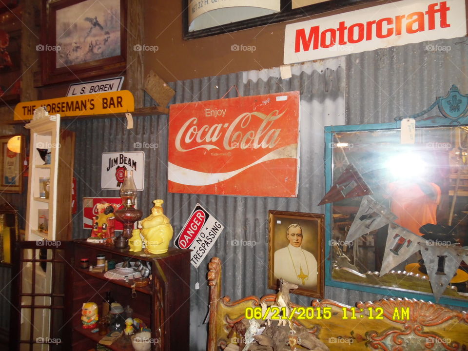 Coke signs. This is a picture of a gift shop in Weatherford Texas where I saw this Coke sign and snapped a photo