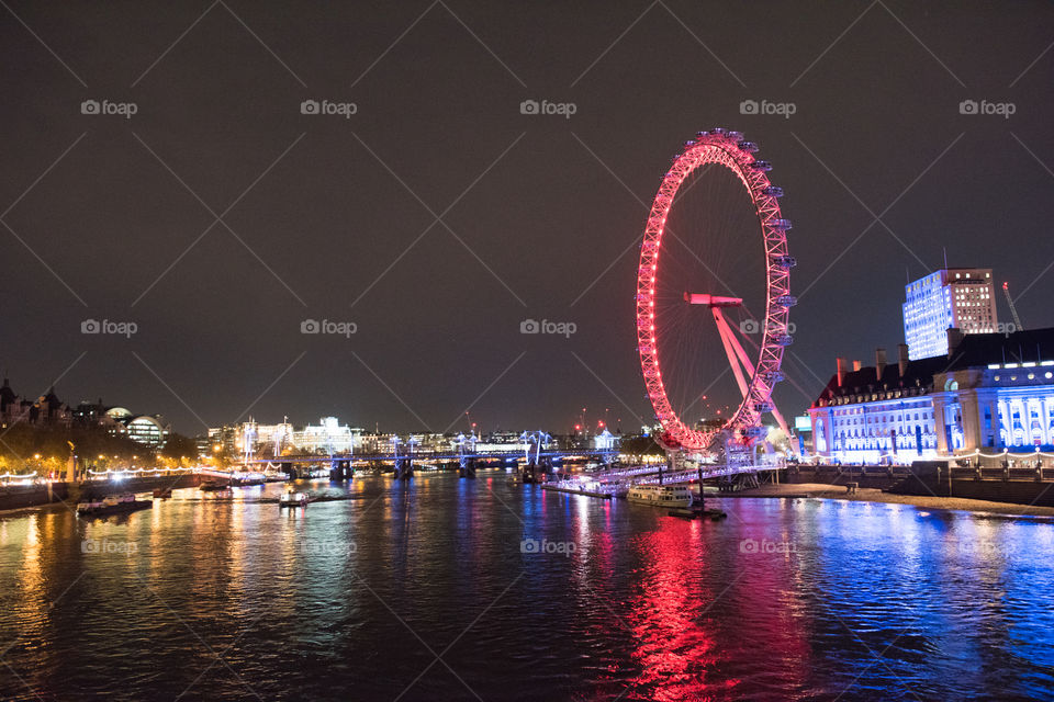 View of the London Eye in London from Westminister Bridge.