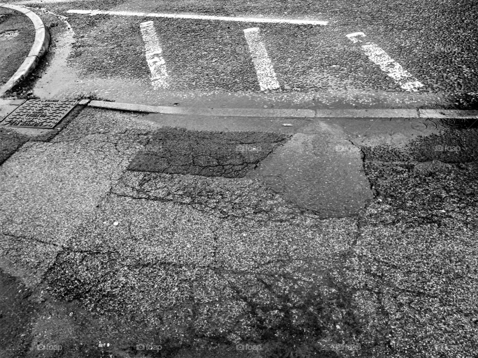 wet road / pavement in black and white