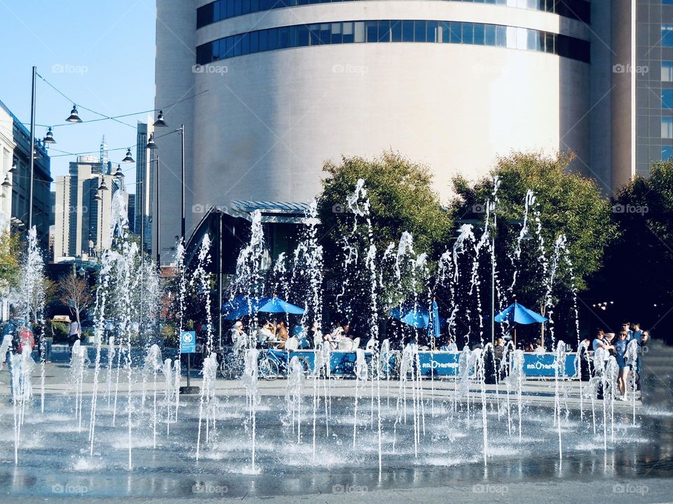 Splash fountain/sprinkler park in the city, a kid’s delightful on a hot summer day. 