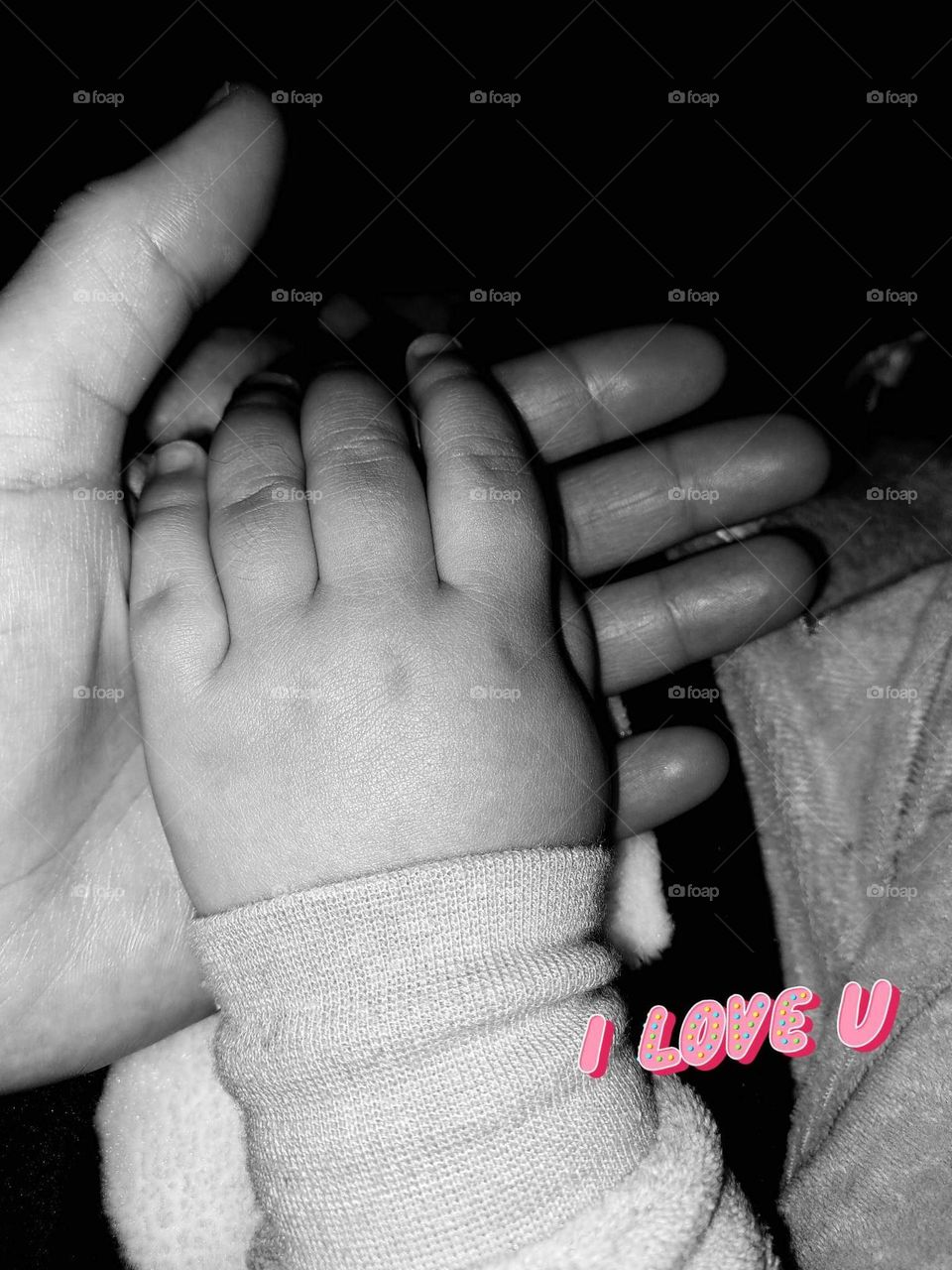 Hand of mom and her daughter