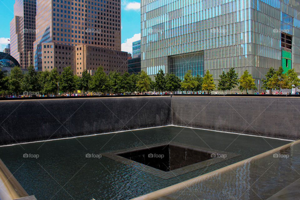 People visiting the World Trade Center memorial in New York, NY
