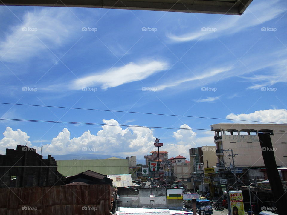 blazing clouds on town