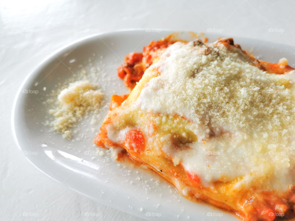 Lasagna Bolognese with parmesan cheese.