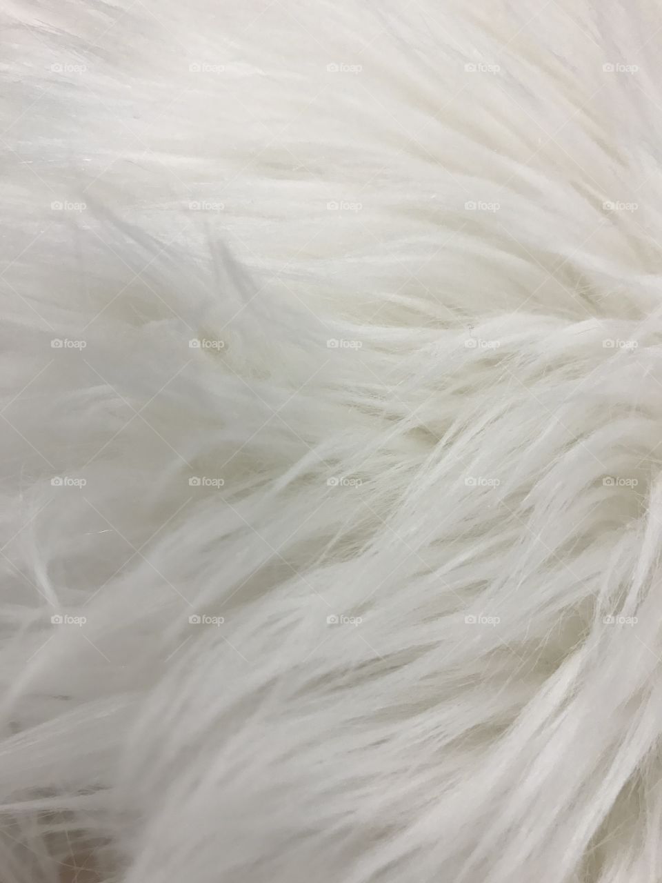 Messy white fur rug