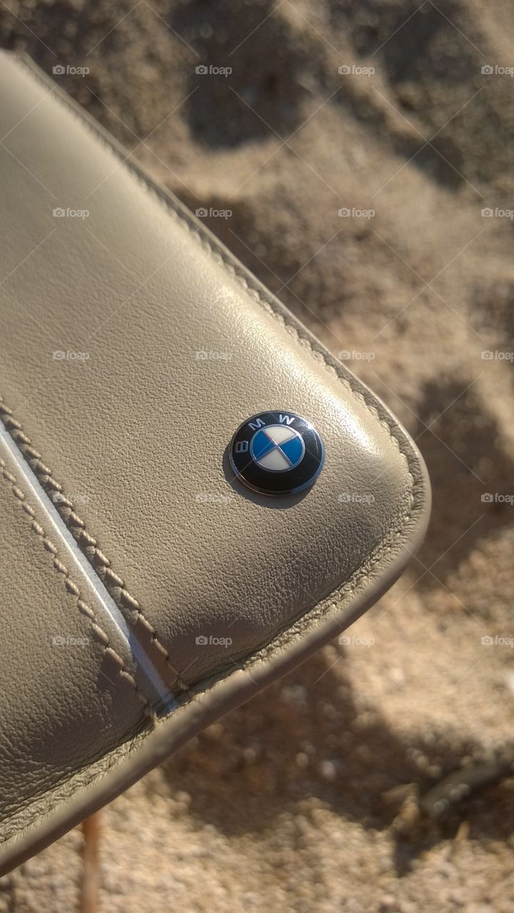 BMW mobile leather case. Official Leather case for mobile case photographed on the beach