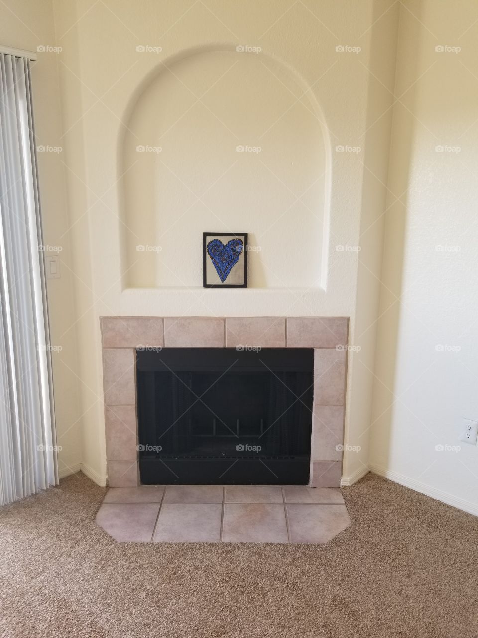 Heart mosaic on top of fireplace