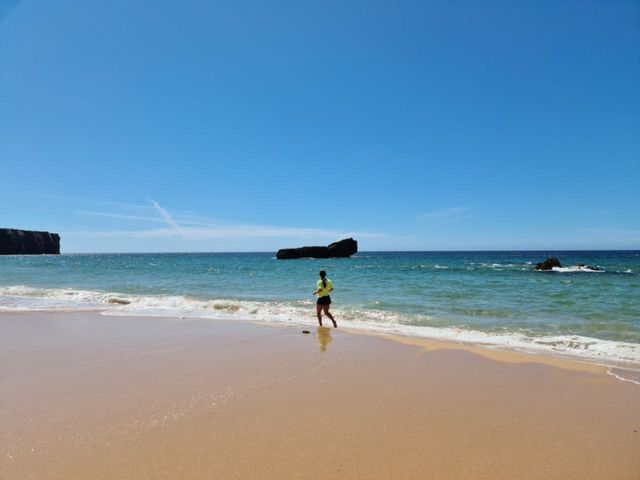Jogging on the beach. Clear sky and hot weather. Peaceful.