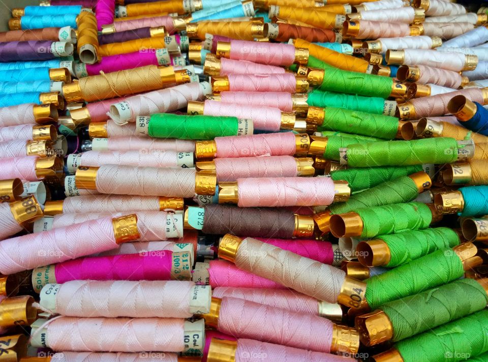 green threads in the market stall