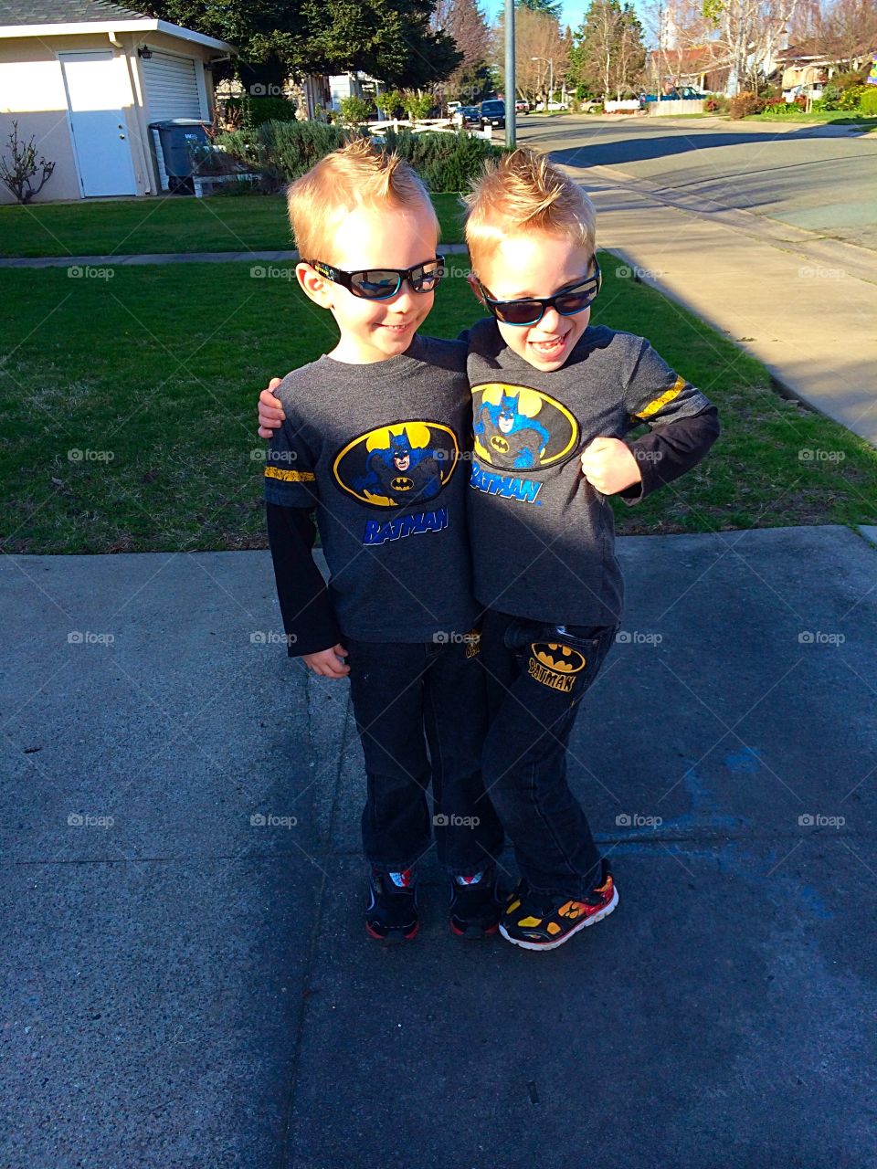 Superheroes in training. Twins posing as superheroes 