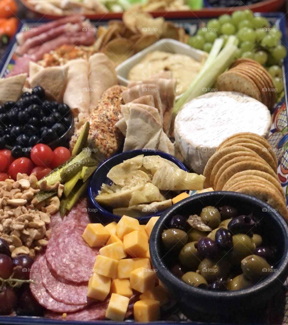A charcuterie board of meats and cheeses