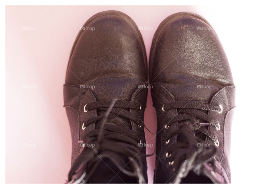 Shoes on pink background still photography
