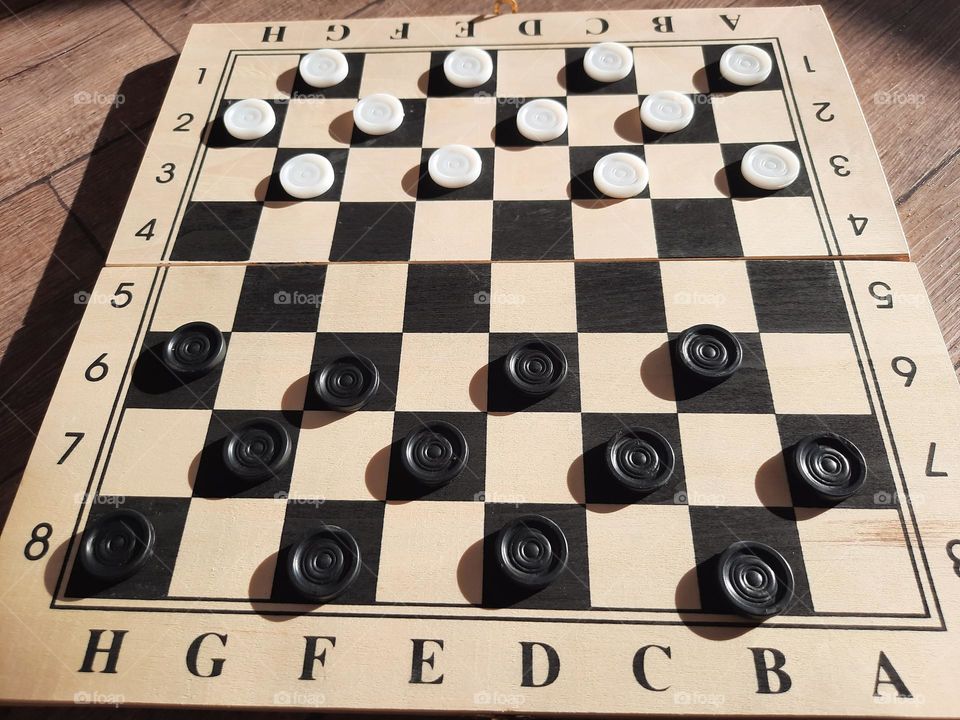 checkers, a board game based on thinking and strategy.