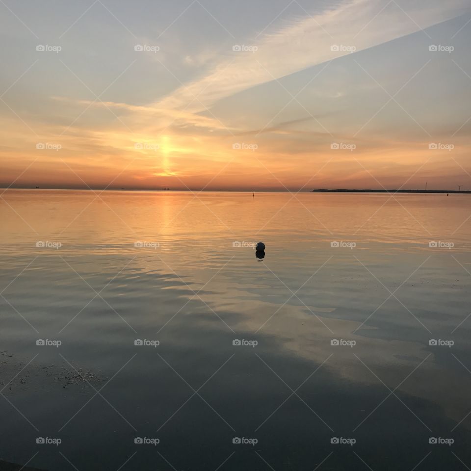 Tranquil scene over the sea with beautiful sunrise