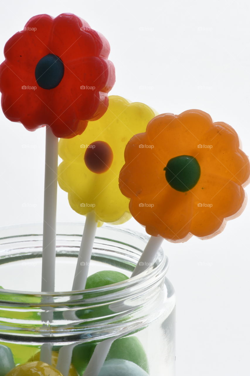 Colorful confection on stick called lollipop.